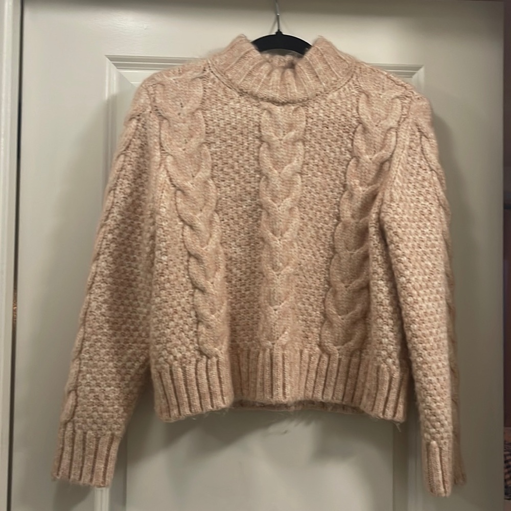 Pink mock neck wool sweater.